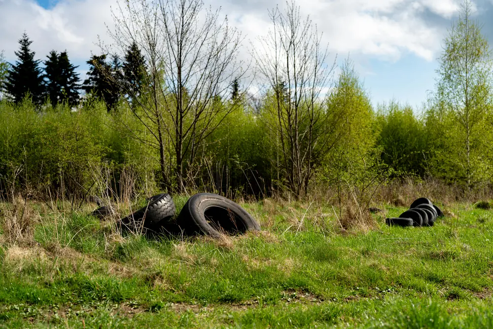 Illegal tyre dumping in a rural location